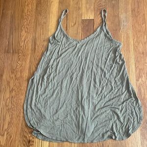 Light green tank, slits on the side